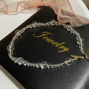 Clear headed necklace